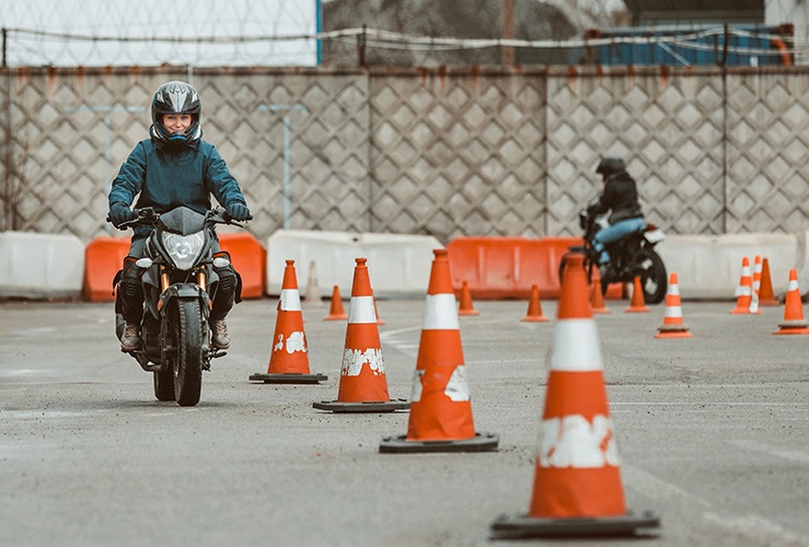 A woman on a motorcycle training course