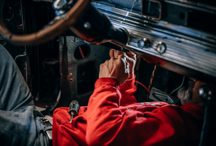 Mechanic working on car electrics