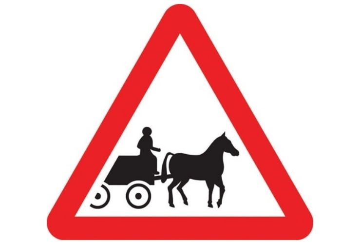 Horse drawn vehicles likely to be in road road sign