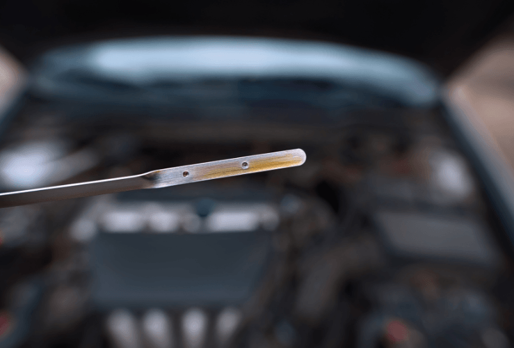 Checking car engine oil dipstick levels