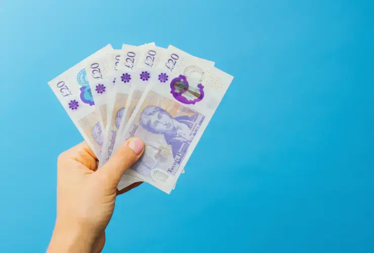 A person holding some money