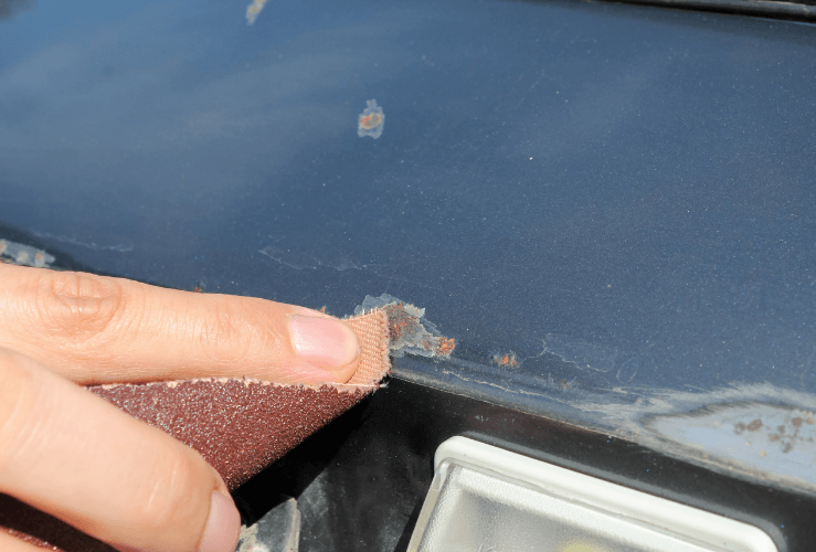 Removing car rust with sandpaper