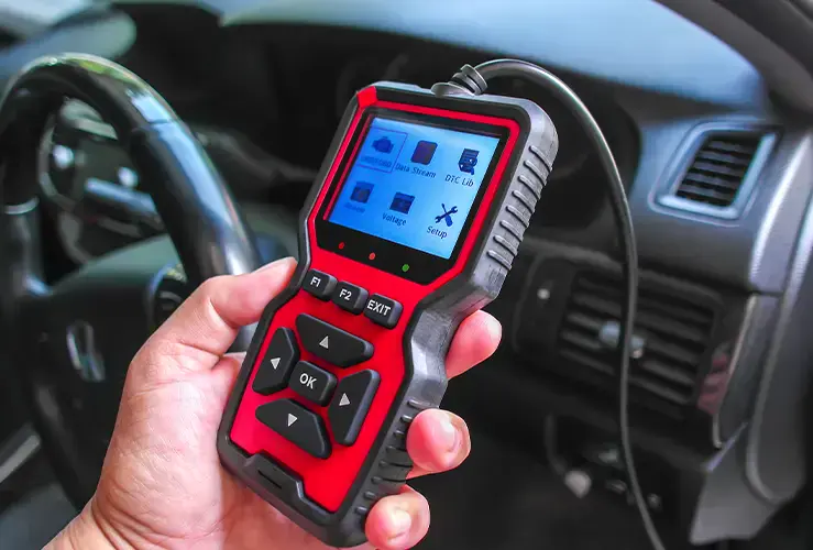 A vehicle diagnostic scanner plugged in