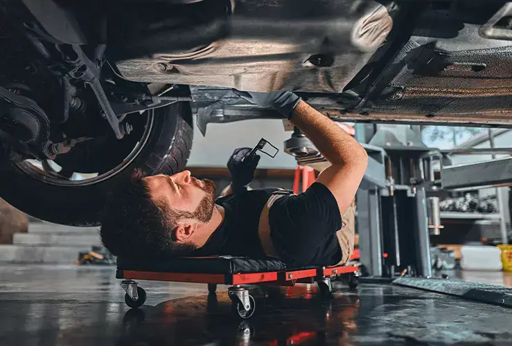 A mechanic working on a car