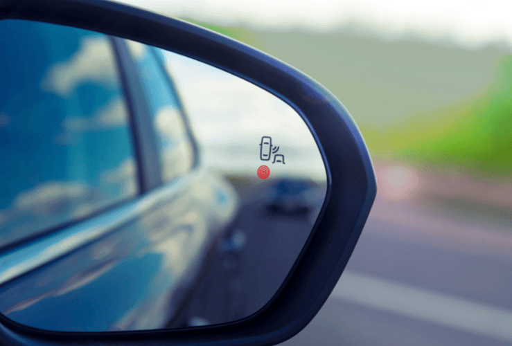 Blind Spot Monitoring system warning light icon in car side view mirror