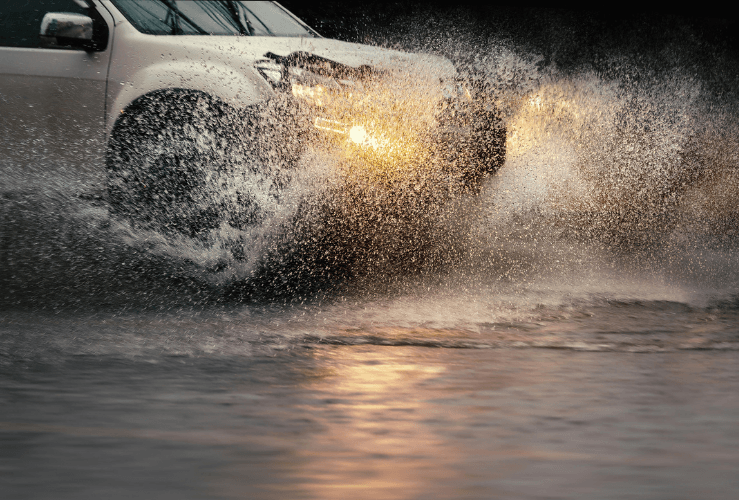 Car driving through flood water