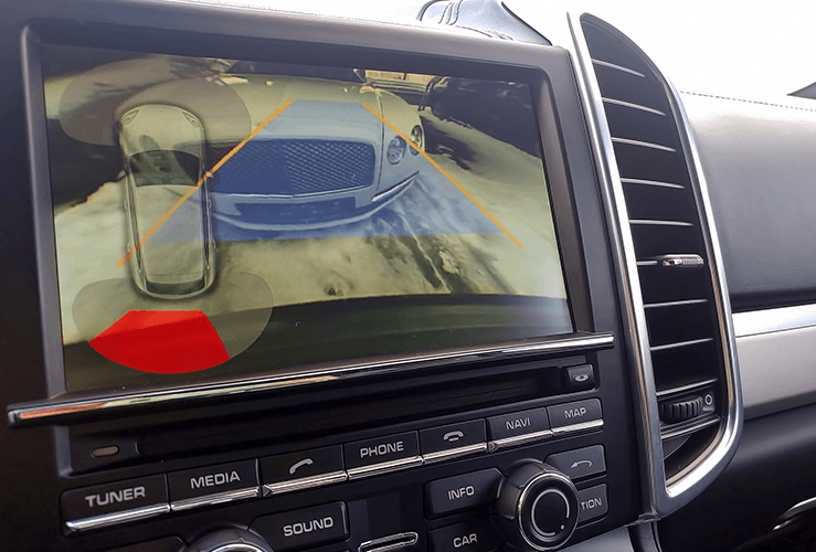 Rearview camera with dynamic trajectory turning lines and parking assistant. Driver assistance systems for parking. View of the monitor.