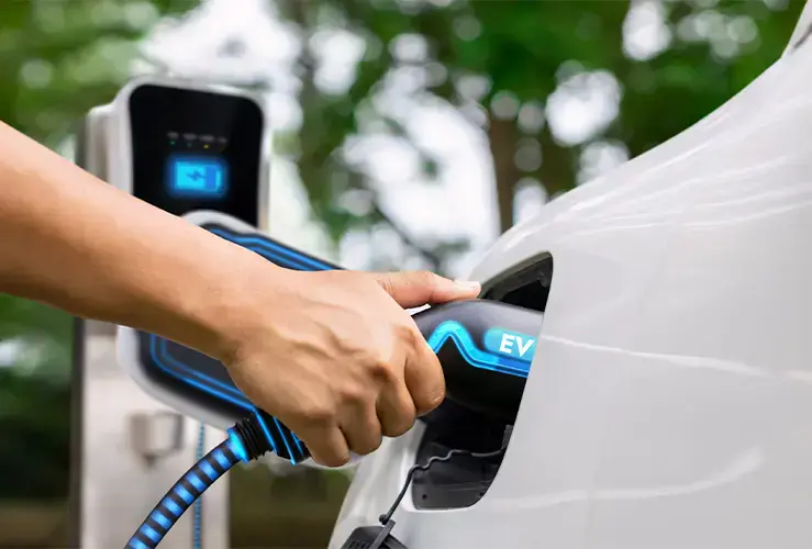 A person charging their electric car
