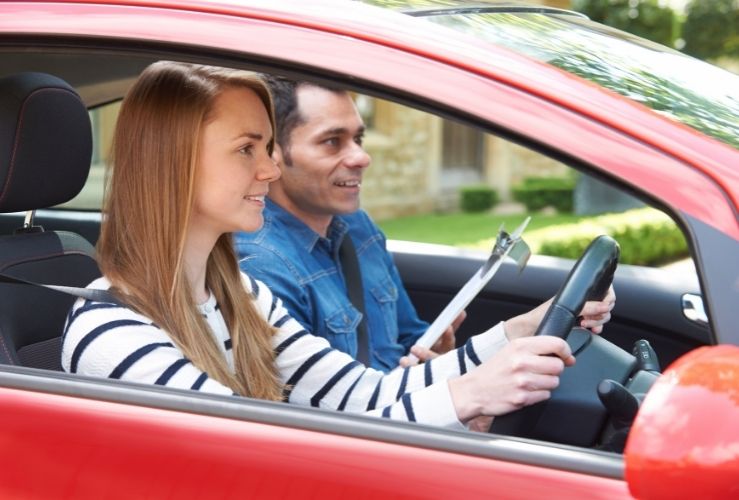 Girl on driving lesson with approved driving instructor