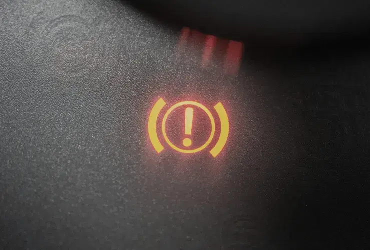 Close up image of handbrake warning light lit up