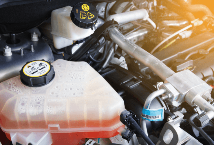 Orange coolant fluid in car coolant tank