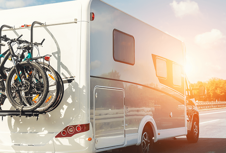 A motorhome driving down a road