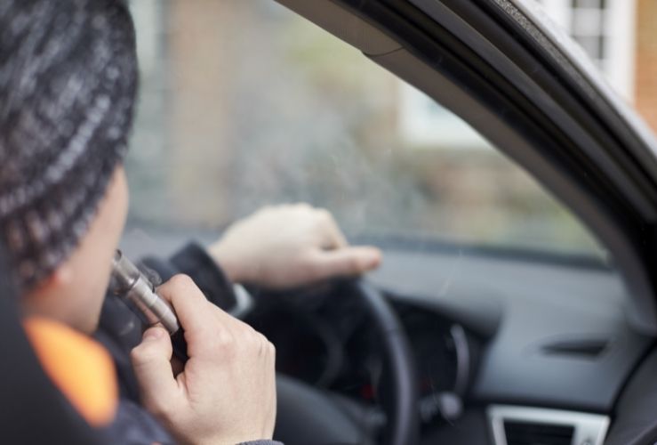 Person vaping whilst driving car