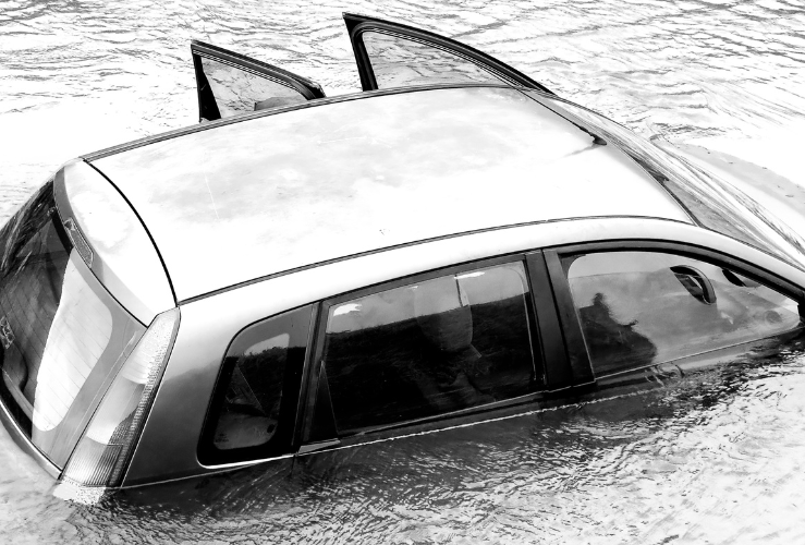 Car sinking in flood water