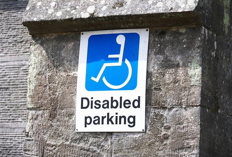 Disabled Parking sign on brick wall 