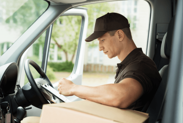 Delivery driver checking route planner
