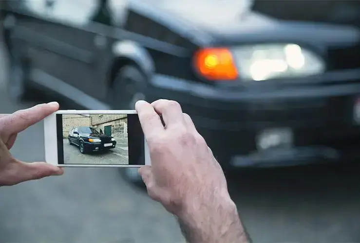 Taking photo of car after a road accident