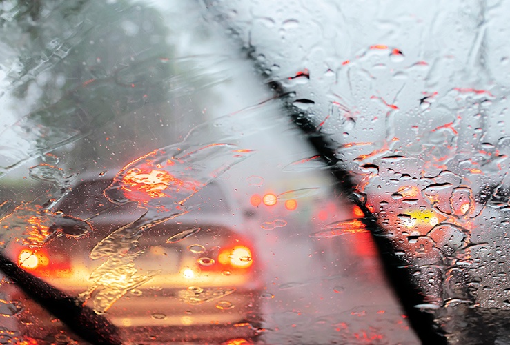 Rain on car window with wipers 